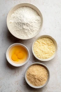 Set up a breading station with bowls of flour, eggs, and seasoned bread crumbs