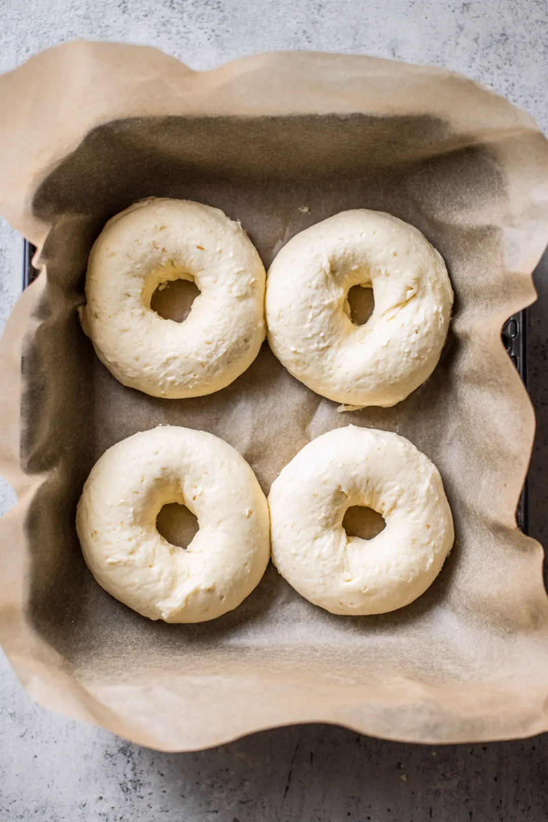 Shape each piece of dough into a bagel and place them in the air fryer