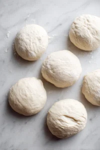 Shape the dough into bagels and place them in the air fryer