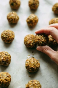 Shape the lentil mixture into small balls or patties, about 1 inch in diameter for even cooking.
