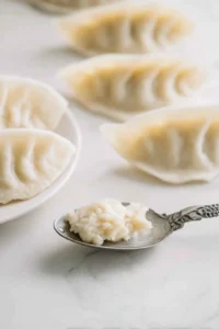 Soak rice paper wraps in warm water until pliable and add filling