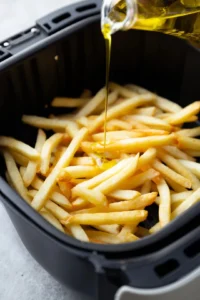 Spread leftover fries in a single layer in the air fryer