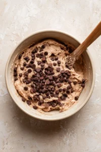 Stir in the chocolate chips and preheat your air fryer to 350 degrees Fahrenheit