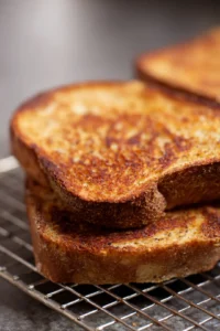 Toast rye bread slices until golden brown and crispy