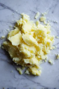 Wash and boil the Yukon Gold potatoes in salted water for about 20 minutes until they are tender