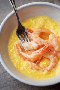 Whisk the egg and coat the shrimp in the egg mixture