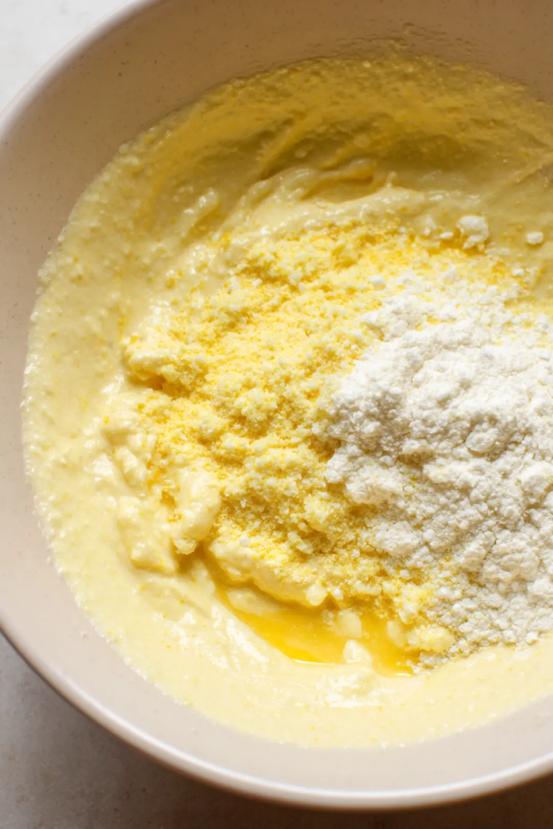 Add cornmeal, beaten egg, and mayonnaise to form batter