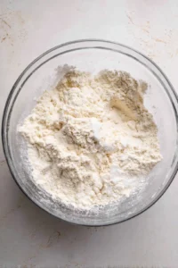 Add garlic powder, onion powder, and salt to the mixture.