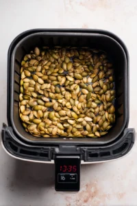 Air fry seeds for 12 to 15 minutes, shaking the basket halfway through for even cooking.