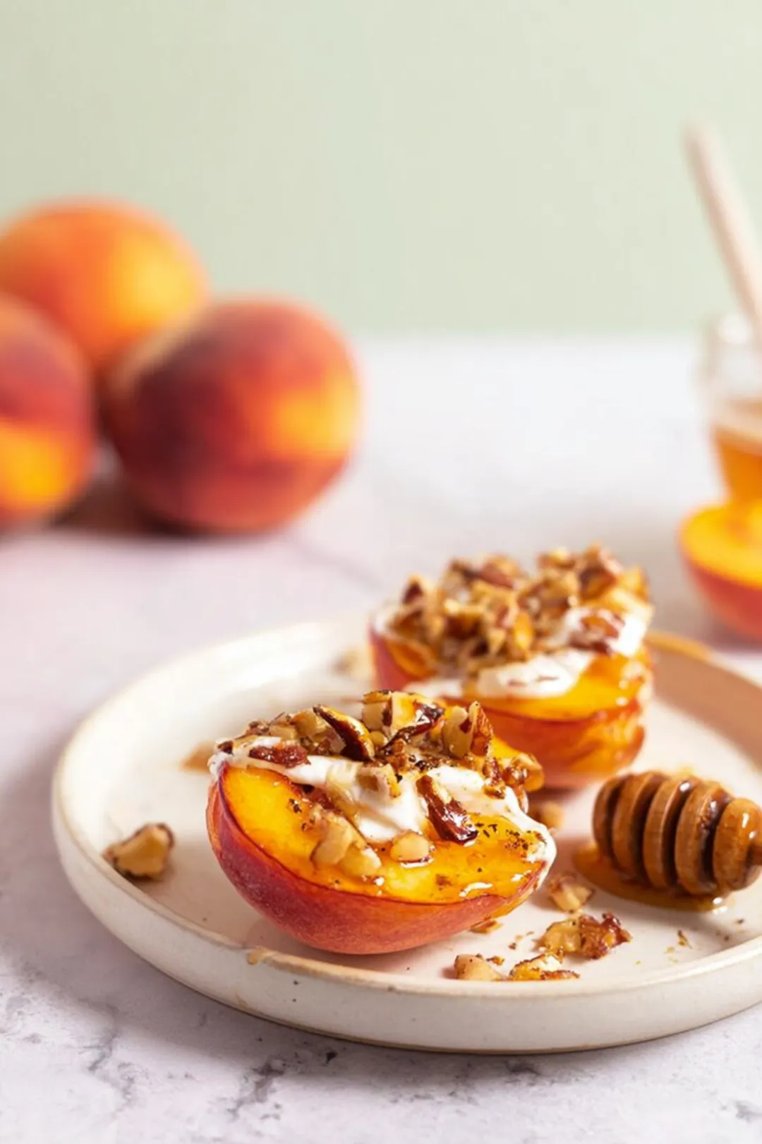 Air fryer peach halves with honey and nuts