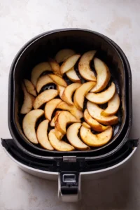 Arrange apple slices in a single layer in the air fryer basket