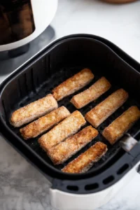 Arrange frozen French toast sticks in air fryer