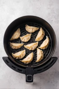 Arrange gyoza in air fryer