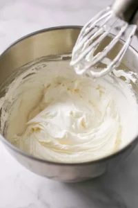Beat the softened cream cheese, sugar, and vanilla extract until smooth and creamy