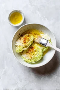 Brush oil mixture over each cabbage steak