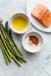 Brush salmon fillets and asparagus with olive oil mixture