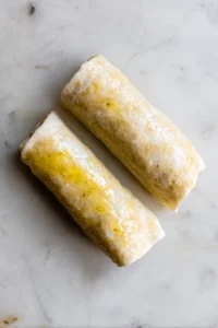 Brush the frozen burritos lightly with olive oil to enhance crispiness during cooking.