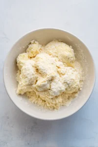 Coat chicken in potato starch mixed with salt and pepper