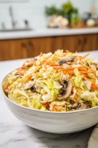 Combine cabbage, carrot, mushrooms, and soy sauce in a bowl