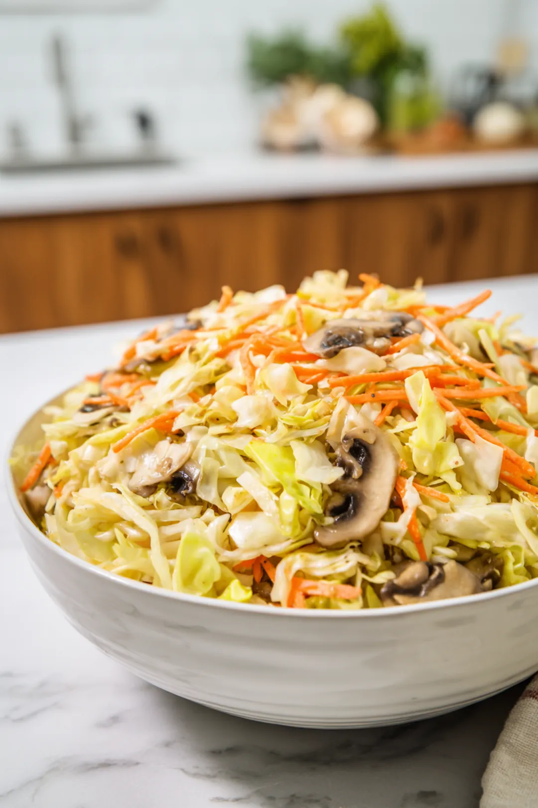 Combine cabbage, carrot, mushrooms, and soy sauce in a bowl