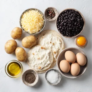 Combine cooked diced potatoes, black beans, scrambled eggs, and cheese in a bowl