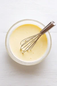 Combine egg, milk, sugar, and vanilla extract in a bowl