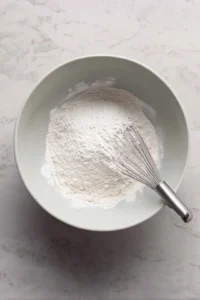 Combine flour, sugar, baking powder, and salt in a large bowl