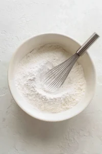 Combine flour, sugar, baking powder, and salt in a large bowl