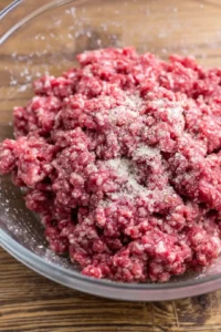 Combine ground beef with seasonings and form slider patties