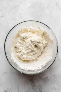 Combine self-rising flour and Greek yogurt to form a dough