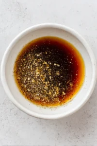 Combine soy sauce, brown sugar, garlic powder, and black pepper to create the marinade