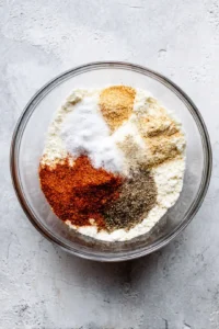 Combine the flour, paprika, garlic powder, salt, and pepper in a bowl