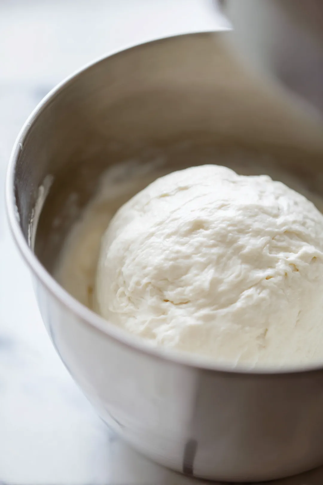 Combine warm water, sugar, and yeast in a large bowl and let it sit for 5 minutes until foamy
