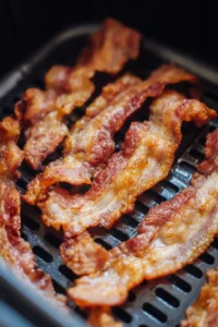 Cook bacon until crispy and drain on paper towels