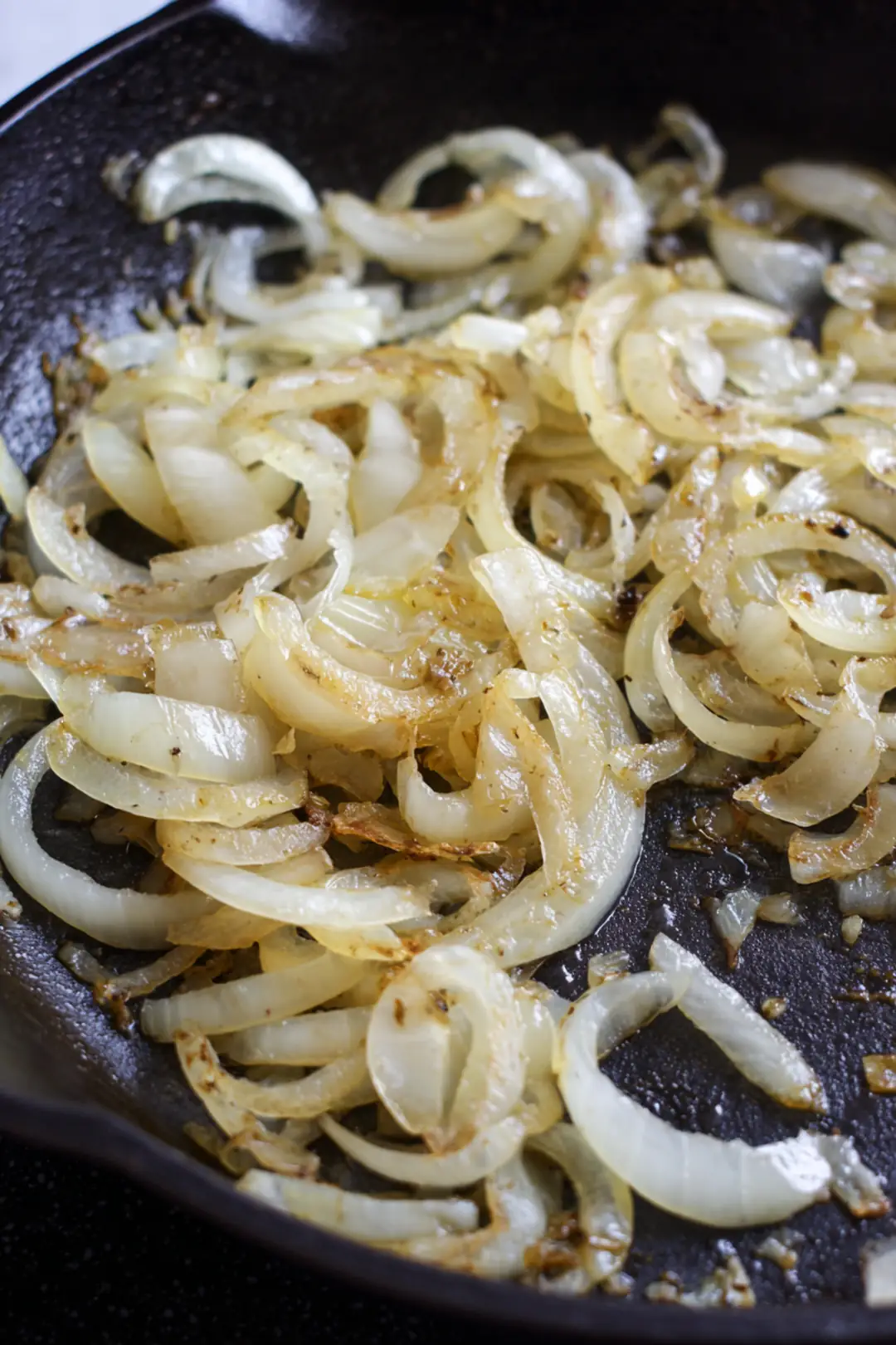 Cook onions in a skillet with butter
