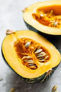 Cut the acorn squash in half and slice it into thin wedges