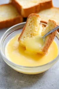 Dip bread slices into custard mixture to coat well
