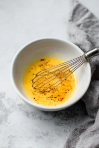 Dip catfish nuggets in egg mixture and coat with dry mixture