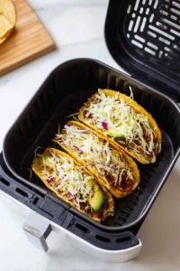 Fill corn tortillas with fish mixture and toppings