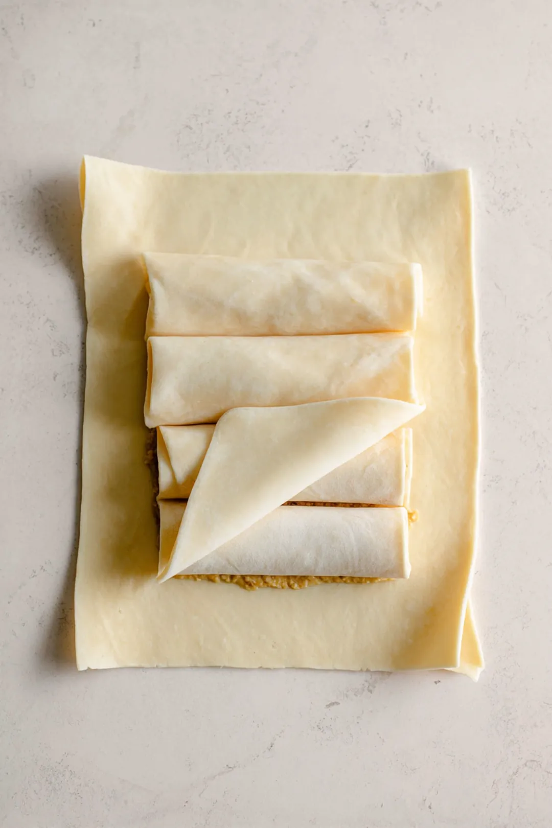 Fill spring roll wrapper with filling and wrap tightly