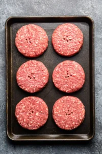 Form burger patties with indent in center
