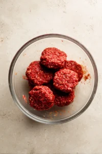 Form small patties with seasoned ground beef