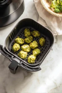 Form small tots with the mixture and place them in the air fryer basket
