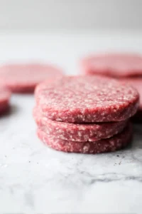 Form the mixture into round patties, about half an inch thick. Ensure they are uniform in size for even cooking.