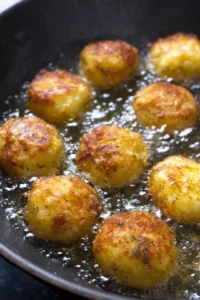 Fry the batter in hot oil until golden brown