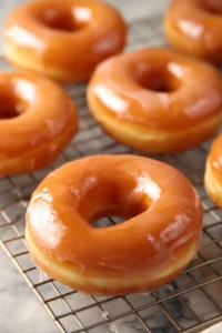 Let the donuts cool slightly and dip them in the glaze