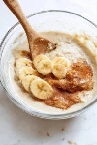 Mash overripe bananas until smooth and mix in sugar, milk, and cinnamon