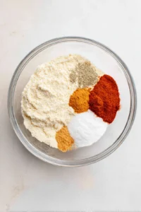Mix almond flour, salt, pepper, paprika, and cayenne pepper for the breading