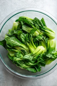 Mix bok choy with soy ginger marinade