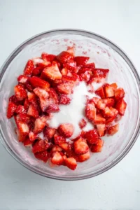 Mix diced strawberries, sugar, and cornstarch in a bowl until well combined